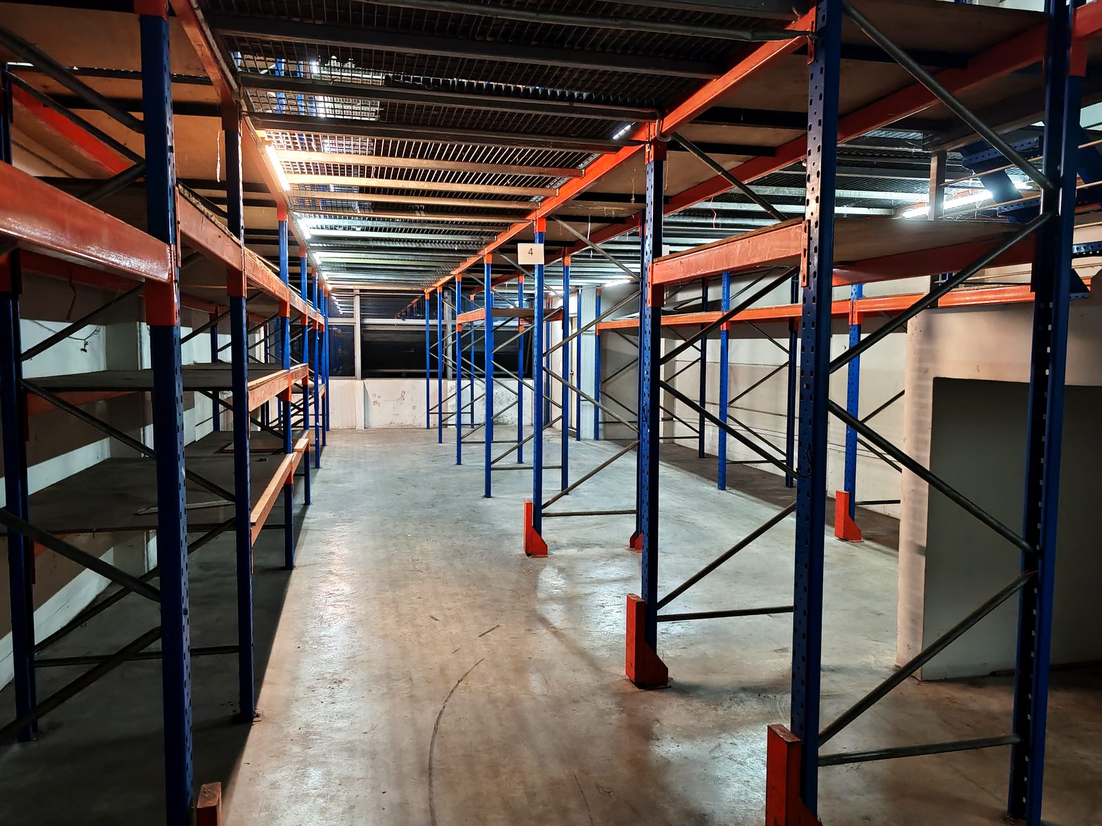 Racking aisle inside the 4,206 sqft B2 warehouse at 48 Enterprise Hub